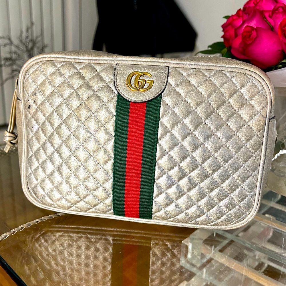 Gucci. Used. My favorite purse so used for a while but still looks great